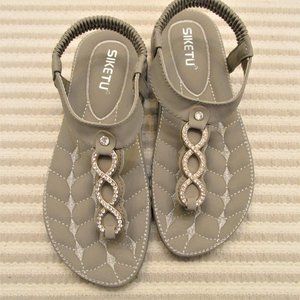 Gray leather sandals.